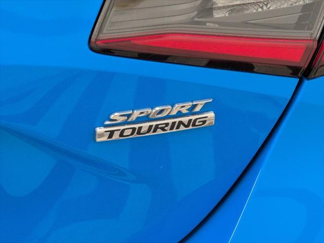Photo of 2024 Boost Blue Pearl Honda Civic