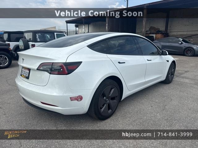 Photo of 2023 Pearl White Multi Tesla Model 3