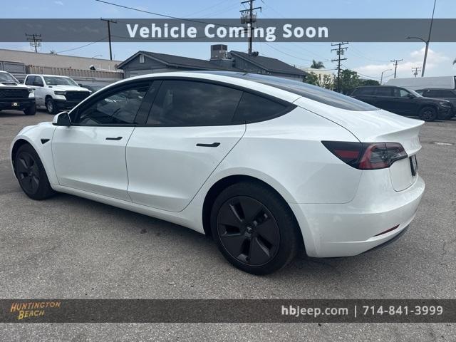Photo of 2023 Pearl White Multi Tesla Model 3