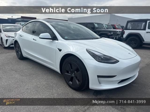 Photo of 2023 Pearl White Multi Tesla Model 3