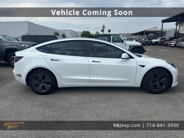 Photo of 2023 Pearl White Multi Tesla Model 3