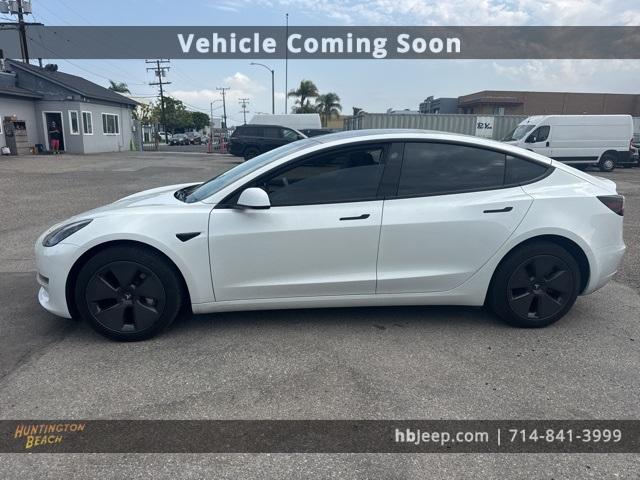 Photo of 2023 Pearl White Multi Tesla Model 3