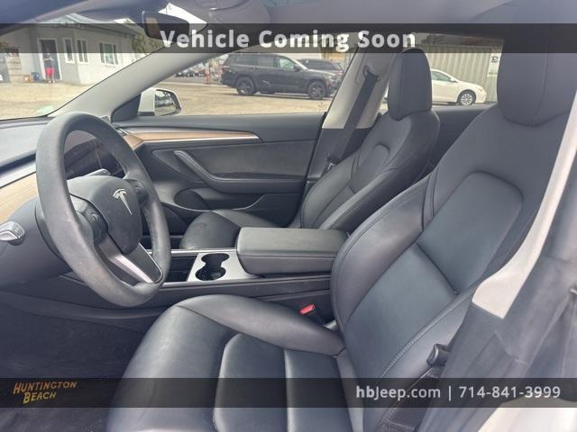 Photo of 2023 Pearl White Multi Tesla Model 3