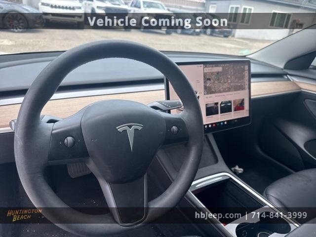 Photo of 2023 Pearl White Multi Tesla Model 3