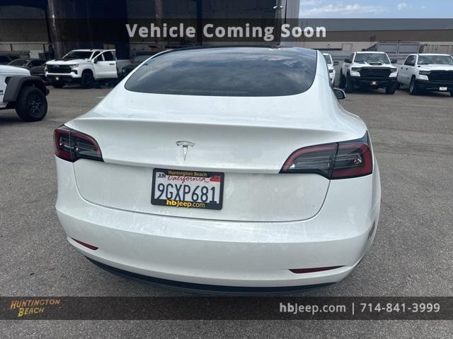 Photo of 2023 Pearl White Multi Tesla Model 3
