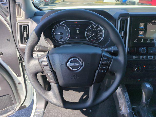 Photo of 2025 Glacier White Nissan Frontier