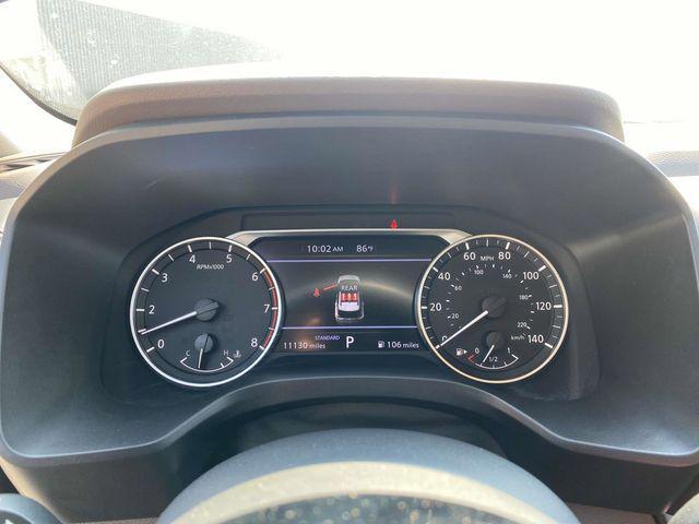 Photo of 2023 Pearl White Tricoat Nissan Rogue