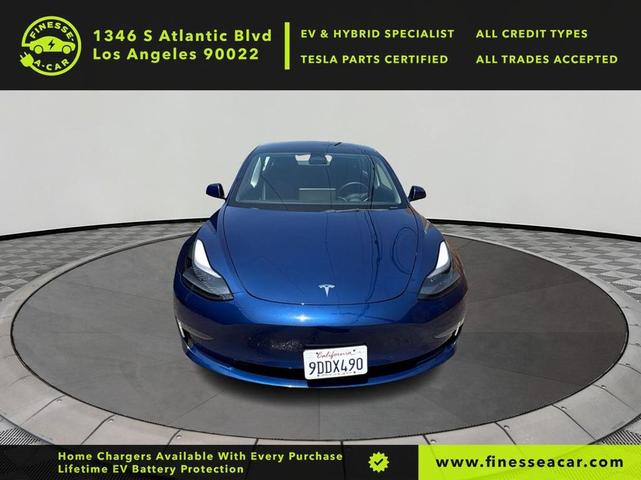 Photo of 2022 Deep Blue Metallic Tesla Model 3