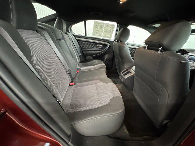 Photo of 2014 SUNSET METALLIC Ford Taurus