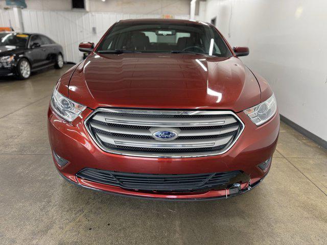 Photo of 2014 SUNSET METALLIC Ford Taurus