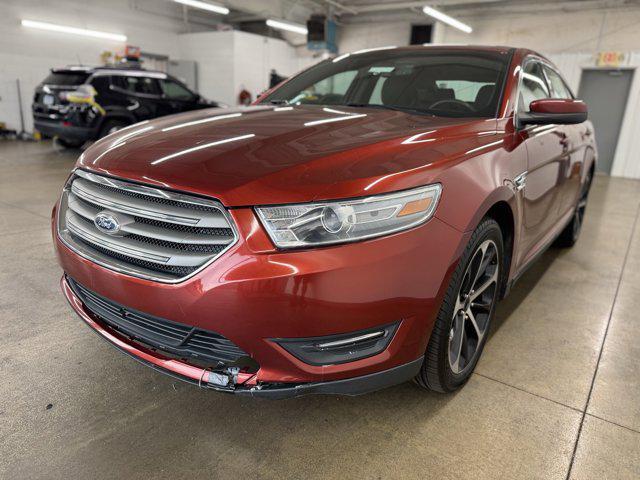 Photo of 2014 SUNSET METALLIC Ford Taurus