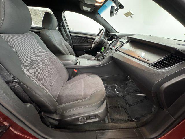 Photo of 2014 SUNSET METALLIC Ford Taurus