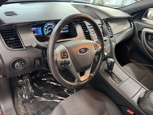 Photo of 2014 SUNSET METALLIC Ford Taurus