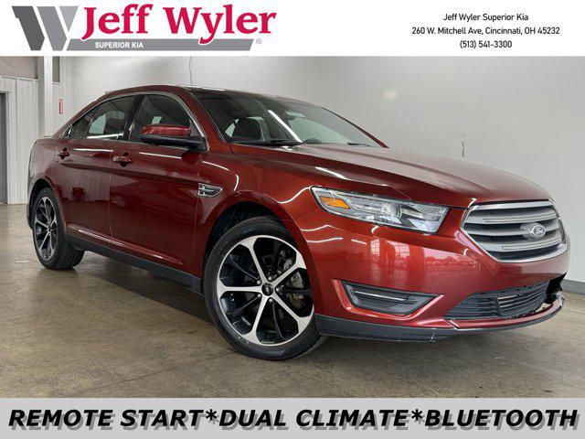 Photo of 2014 SUNSET METALLIC Ford Taurus
