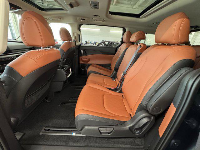 Photo of 2026 Astra Blue Kia Carnival Hybrid