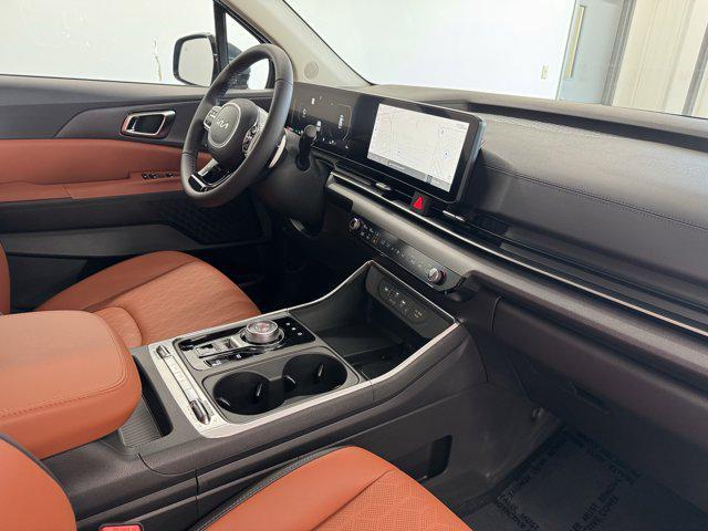 Photo of 2026 Astra Blue Kia Carnival Hybrid