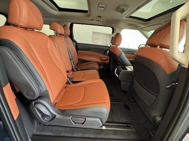Photo of 2026 Astra Blue Kia Carnival Hybrid