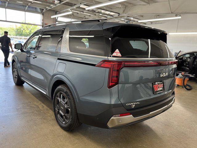 Photo of 2026 Astra Blue Kia Carnival Hybrid