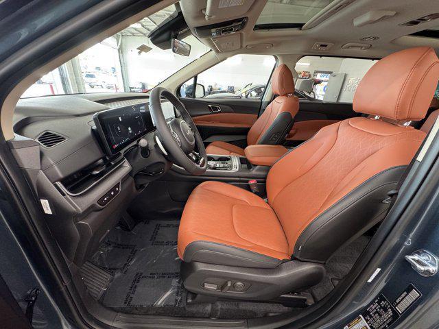 Photo of 2026 Astra Blue Kia Carnival Hybrid