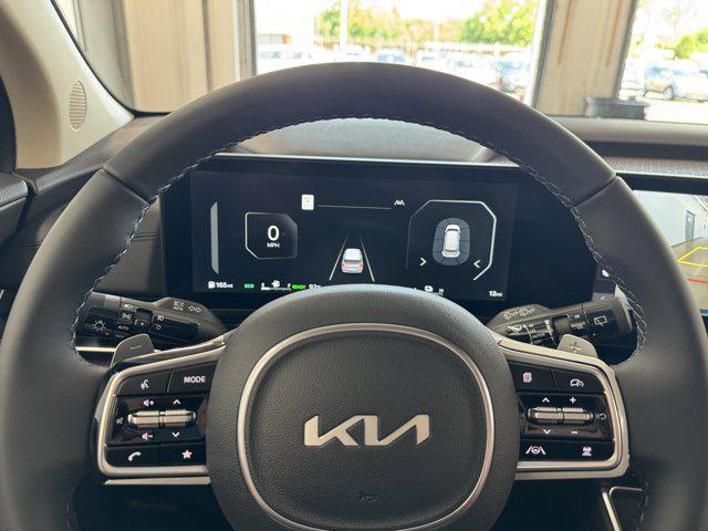 Photo of 2026 Astra Blue Kia Carnival Hybrid