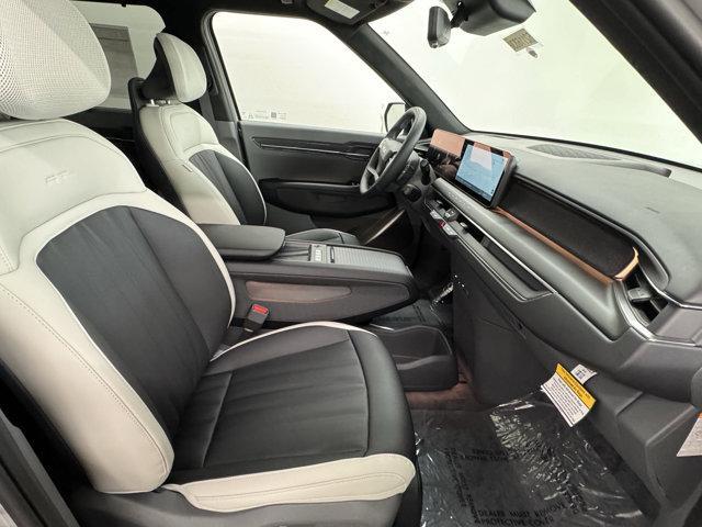 Photo of 2026 Glacier White Pearl/Ebony Black Roof Kia EV9
