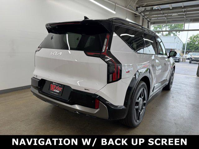 Photo of 2026 Glacier White Pearl/Ebony Black Roof Kia EV9