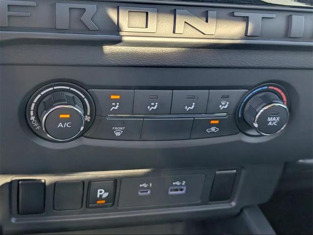 Photo of 2025 Glacier White Nissan Frontier