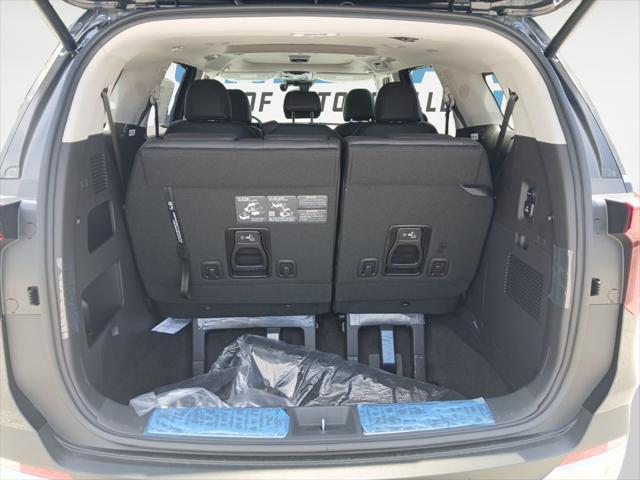 Photo of 2026 Aurora Blue Kia Carnival Hybrid