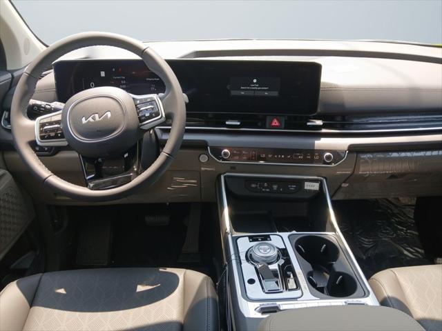 Photo of 2026 Aurora Blue Kia Carnival Hybrid