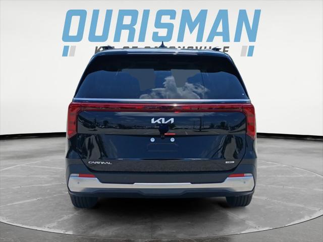 Photo of 2026 Aurora Blue Kia Carnival Hybrid