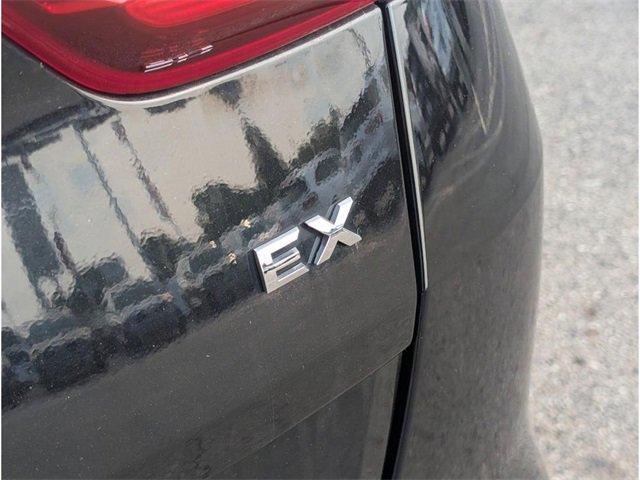 Photo of 2021 Black Cherry Kia Sportage