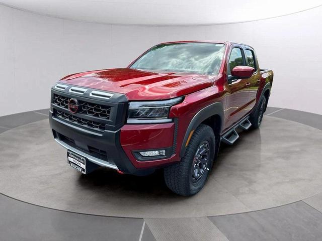 Photo of 2025 Cardinal Red Metallic Tricoat Nissan Frontier