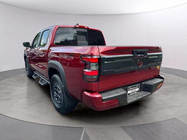 Photo of 2025 Cardinal Red Metallic Tricoat Nissan Frontier