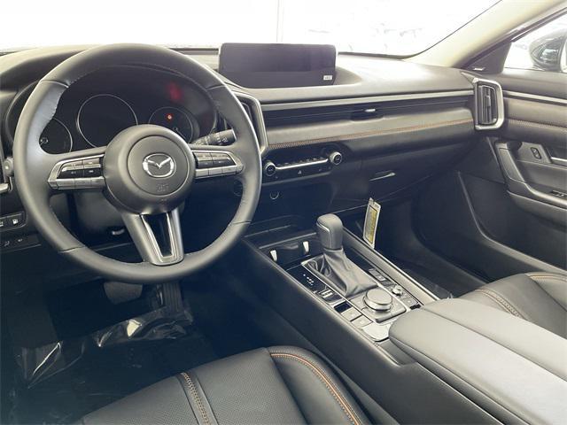 Photo of 2025 Ingot Blue Metallic Mazda CX-50 Hybrid