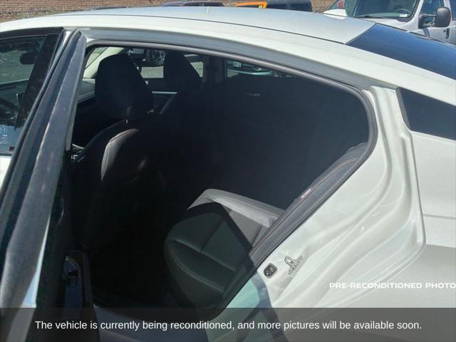 Photo of 2024 Pearl White Tricoat Nissan Altima