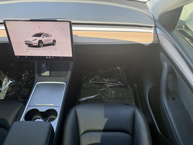 Photo of 2024 Pearl White Multi-Co Tesla Model Y