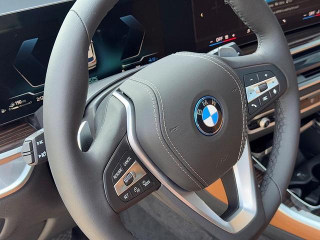 Photo of 2026 Mineral White Metallic BMW X5 PHEV