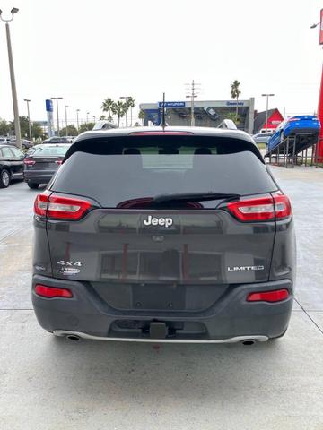 Photo of 2014 Eco Green Pearlcoat Jeep Cherokee