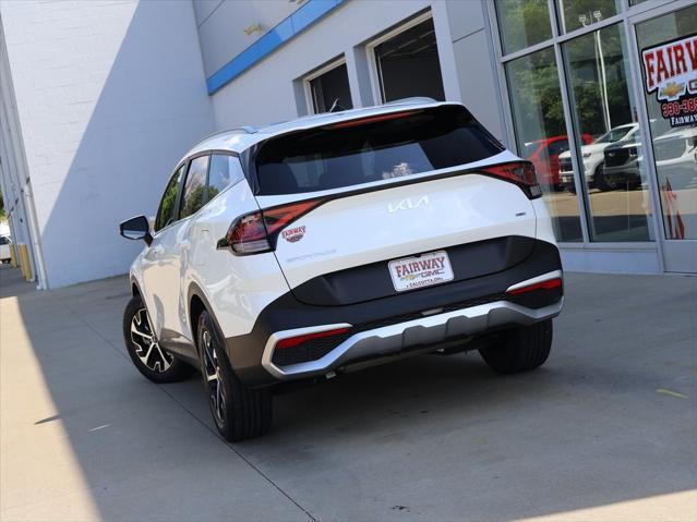 Photo of 2023 Snow White Pearl Kia Sportage Hybrid
