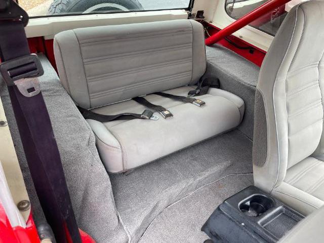 Photo of 1989 Red Jeep Wrangler