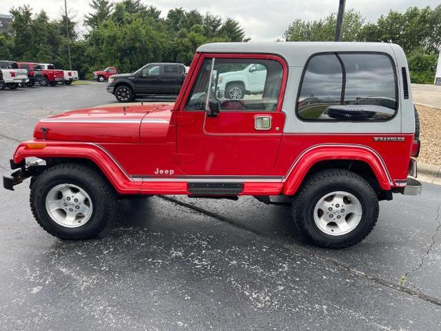 Photo of 1989 Red Jeep Wrangler