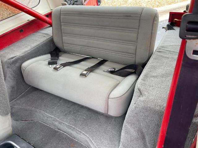 Photo of 1989 Red Jeep Wrangler