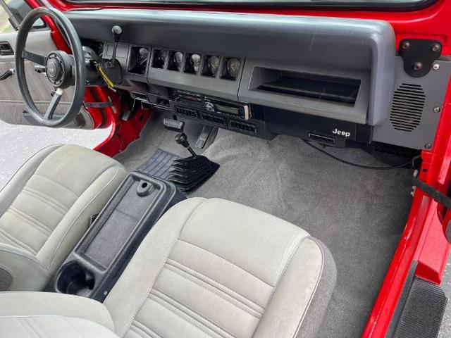 Photo of 1989 Red Jeep Wrangler