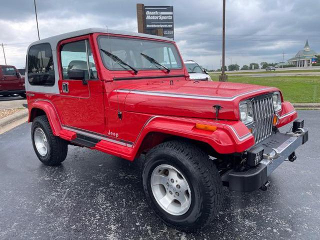 Photo of 1989 Red Jeep Wrangler