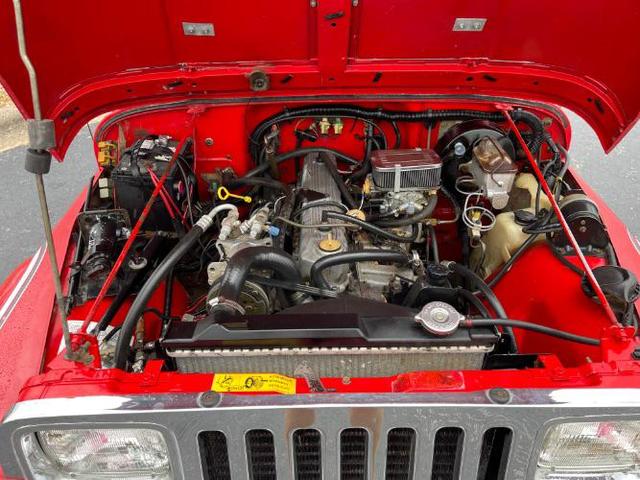Photo of 1989 Red Jeep Wrangler