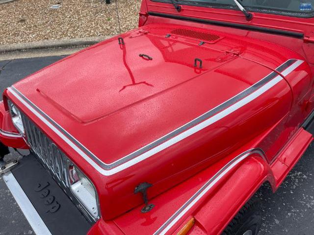 Photo of 1989 Red Jeep Wrangler