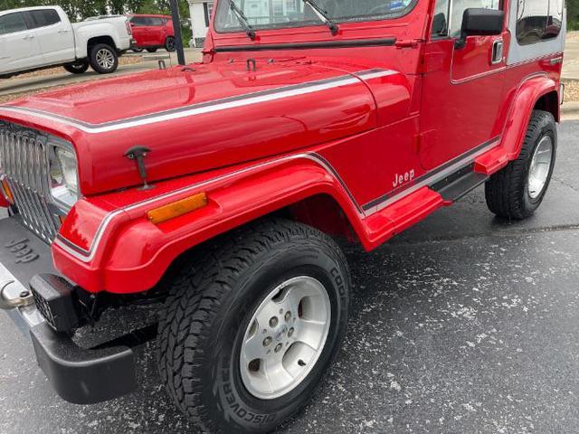 Photo of 1989 Red Jeep Wrangler