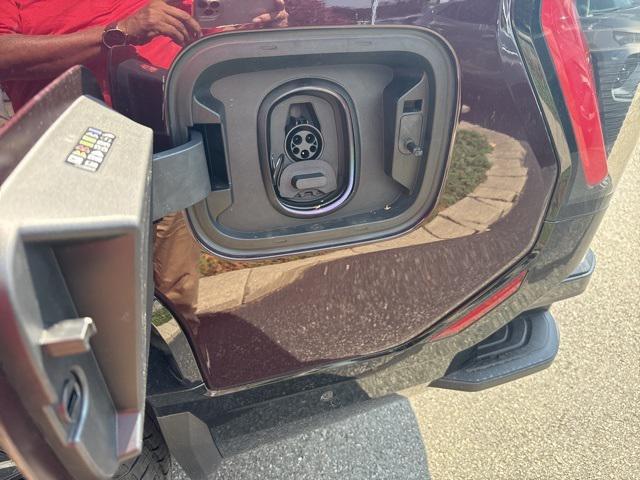 Photo of 2025 Dark Ember Tintcoat GMC Sierra EV