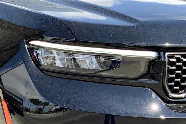 Photo of 2025 Diamond Black Crystal Pearlcoat Jeep Grand Cherokee L
