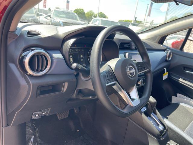 Photo of 2025 Scarlet Ember Tintcoat Nissan Versa